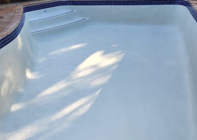 Finished pool with no more cracks and white interior.